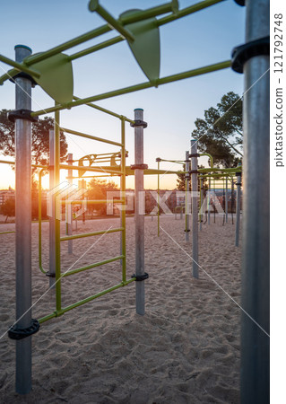 street fitness park for workout and calisthenics area, sport equipment with bars for push and pull ups, healthy lifestyle concept 121792748