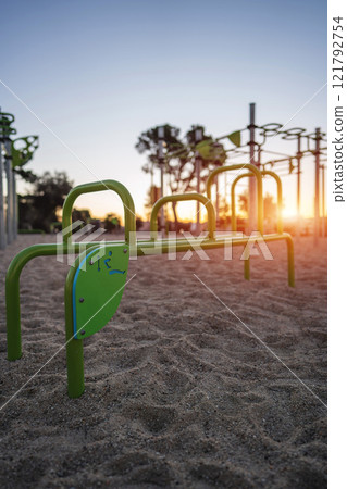 street fitness park for workout and calisthenics area, sport equipment with bars for push and pull ups, healthy lifestyle concept 121792754