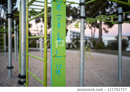 street fitness park for workout and calisthenics area, sport equipment with bars for push and pull ups, healthy lifestyle concept street fitness park for workout and calisthenics area, sport equipment with bars for push and pull ups, healthy lifestyle concept 121792757