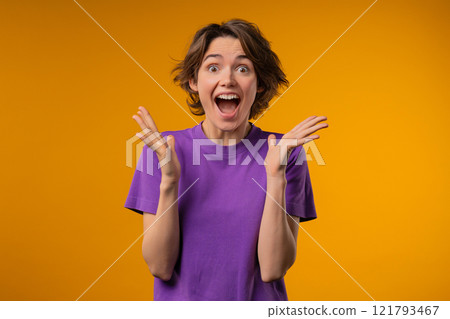 Surprised woman, she expresses WOW, cant believe. Impressed lady trying to get attention. Concept of sales, profitable offer. Excited romantic girl on yellow background 121793467