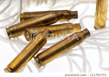 shoot casing .223 shells string and white background  121793755