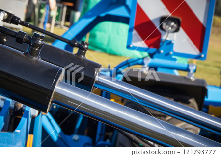 Black pistons or actuators in blue pneumatic or hydraulic machine. Technology 121793777