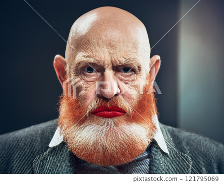 Old grumpy wrinkled man looking at camera 121795069