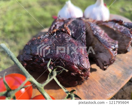 juicy steak on a chopping board surrounded by vegetables and fruits. High q.. juicy steak on a chopping board surrounded by vegetables and fruits. High q.. 121795604