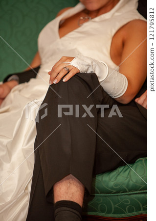 An Elegant Couple Dressed in Formal Attire Beautifully Captured in a Romantic Setting 121795812