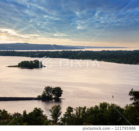 Dnipro river summer evening view from Taras Hill or Chernecha Hora (Monk Hill - important landmark of the Taras Shevchenko National Preserve, Kaniv, Cherkasy Region, Ukraine. 121795986