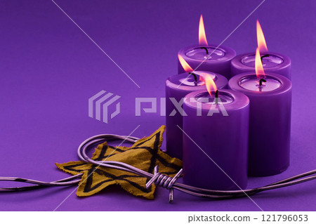 Holocaust memorial day. Purple Candles with Star Holocaust memorial day. Purple Candles with Star 121796053