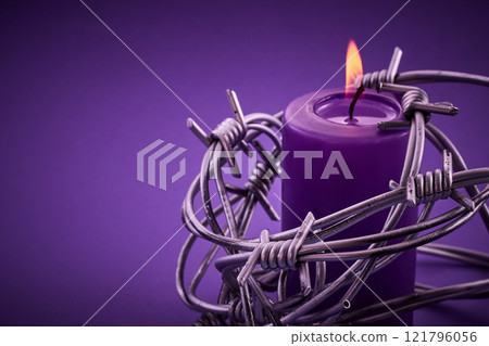 Holocaust memorial day. Candle and Barbed Wire Holocaust memorial day. Candle and Barbed Wire 121796056