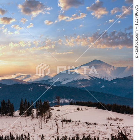 Evening winter cloudy day mountain ridge Evening winter cloudy day mountain ridge 121796075