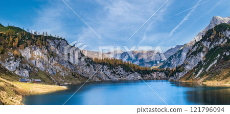 Sunny autumn alpine Tappenkarsee lake and rocky mountains above, Kleinarl, Land Salzburg, Austria. 121796094