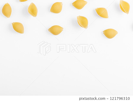 Pasta products in the form of a shell, texture, on a white background 121796310