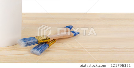 white paint with a brush on a wooden background with texture white paint with a brush on a wooden background with texture 121796351