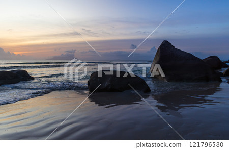 Beau Vallon Beach landscape with wet sand and stones 121796580