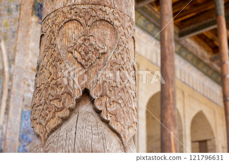 Ancient carved wooden pillar. Bolo Haouz Mosque exterior details 121796631