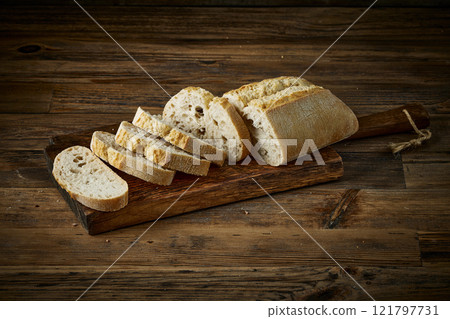 sliced bread on wooden table 121797731