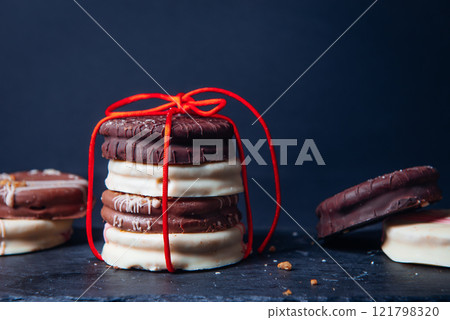 Ischler cookies coated with brown and white chocolate glaze 121798320