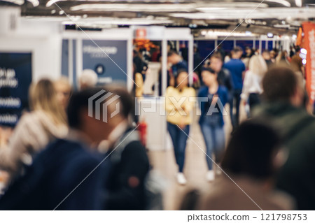Abstract blurred people at exhibition hall of expo event trade show. Business convention show or job fair. Business concept background Abstract blurred people at exhibition hall of expo event trade show. Business convention show or job fair. Business concept background 121798753