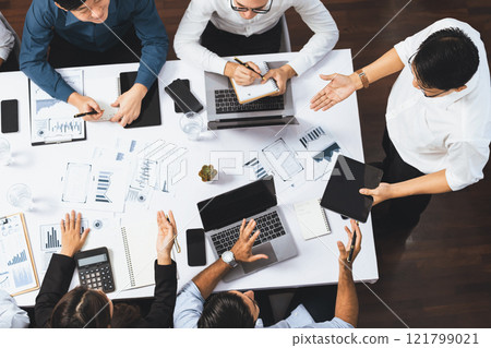 Analyst team utilizing BI Fintech to analyze financial data at table. Prudent Analyst team utilizing BI Fintech to analyze financial data at table. Prudent 121799021