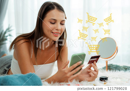 Consumer holding credit card typing phone shopping online inventory. Cybercash. Consumer holding credit card typing phone shopping online inventory. Cybercash. 121799028