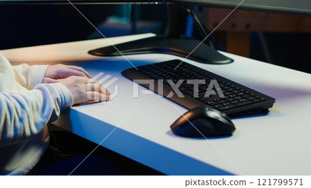 Teleworking computer technician typing on keyboard, implementing security measures to protect company systems and data, close up. Remote IT employee at home debugging code for software, camera A Teleworking computer technician typing on keyboard, implementing security measures to protect company systems and data, close up. Remote IT employee at home debugging code for software, camera A 121799571