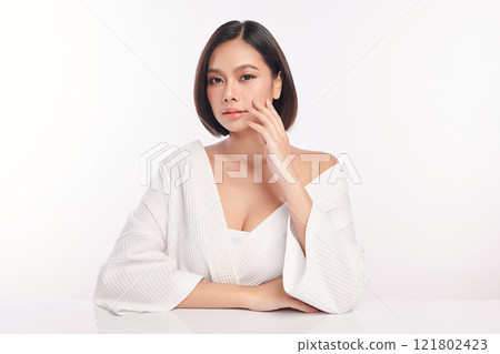 Beautiful young asian woman with clean fresh skin on white background, Face care, Facial treatment, Cosmetology, beauty and spa, Asian women portrait. Beautiful young asian woman with clean fresh skin on white background, Face care, Facial treatment, Cosmetology, beauty and spa, Asian women portrait. 121802423