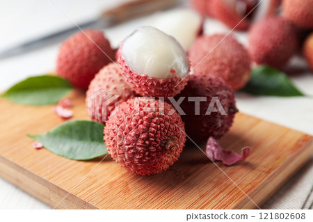 Lychee, concept of fresh and ripe exotic food Lychee, concept of fresh and ripe exotic food 121802608