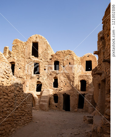 Uninhabited fortified village with houses and granaries, Tunisia. Ksar of Mgabla, Berber, Tataouine. 121802886