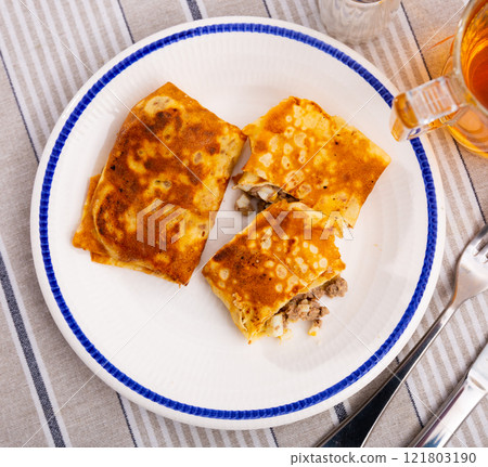 Pancakes stuffed with liver and egg Pancakes stuffed with liver and egg 121803190