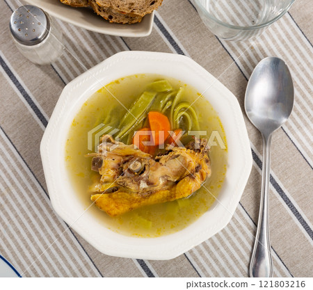 Soup made from fragrant chicken broth, potato slices, pasta and carrots. Soup made from fragrant chicken broth, potato slices, pasta and carrots. 121803216