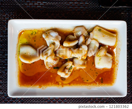 Appetizer cooked fried sepia with spicy sauce. Japanese food 121803362