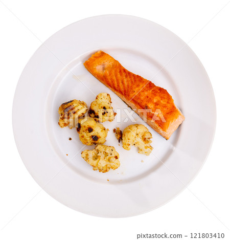 Salmon with cauliflower on a white plate Salmon with cauliflower on a white plate 121803410