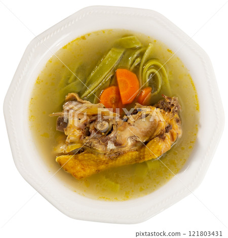 Soup made from fragrant chicken broth, potato slices, pasta and carrots. 121803431