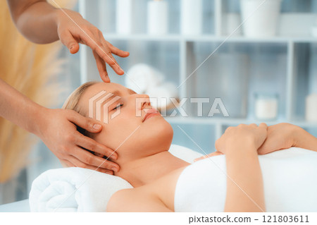 Caucasian woman enjoying relaxing anti-stress head massage. Quiescent 121803611