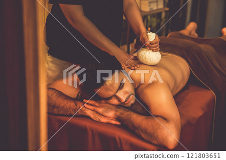 Hot herbal ball spa massage body treatment. Quiescent 121803651