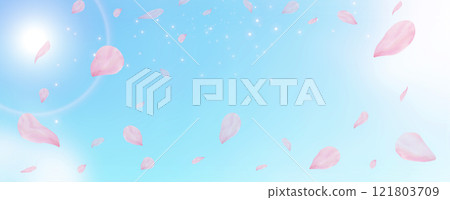 櫻花花瓣飄落在春天的藍天上，閃閃發光 121803709
