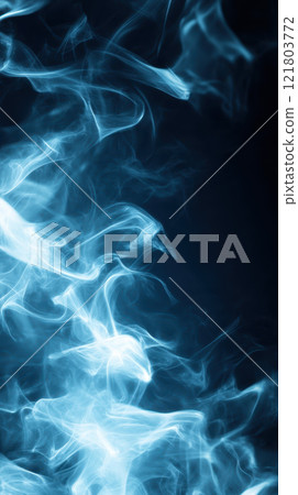 Mysterious blue smoke swirling against dark background Mysterious blue smoke swirling against dark background 121803772