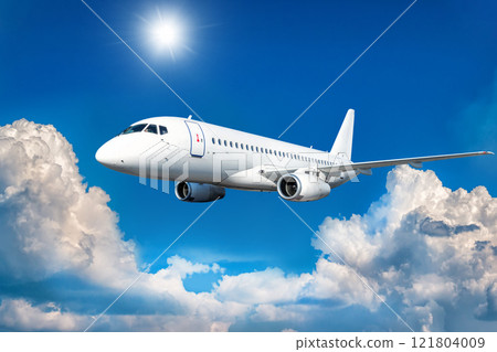 White passenger airliner fly in the air above picturesque clouds 121804009
