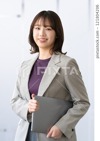 Smiling woman/businesswoman with a laptop 121804206