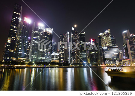 Night view of the Marina Bay Financial Centre and the Raffles Place modern office skyscrapers in Singapore. Night view of the Marina Bay Financial Centre and the Raffles Place modern office skyscrapers in Singapore. 121805539