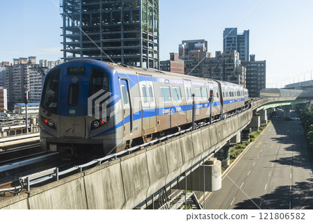 View of a Taoyuan International Airport line train running on the elevated track of the Taoyuan Mass Rapid Transit System. 121806582