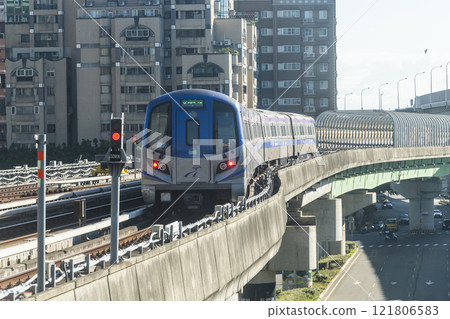 View of a Taoyuan International Airport line train running on the elevated track of the Taoyuan Mass Rapid Transit System. 121806583
