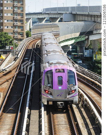View of a Taoyuan International Airport line train running on the elevated track of the Taoyuan Mass Rapid Transit System. View of a Taoyuan International Airport line train running on the elevated track of the Taoyuan Mass Rapid Transit System. 121806586