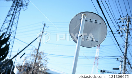 Behind the traffic sign 121806675