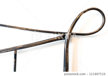 Artistic Wrought Iron Accent on White Background 121807510