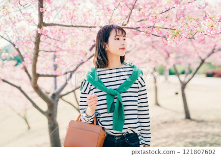 Cherry blossoms and a young woman 121807602