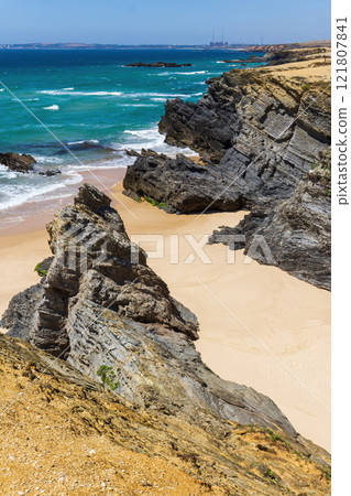 Atlantic ocean coastline with rocks, light sand and turquoise water 121807841