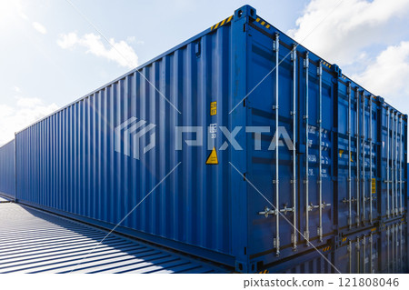 Blue cargo containers are stacked at the storage area in port Blue cargo containers are stacked at the storage area in port 121808046