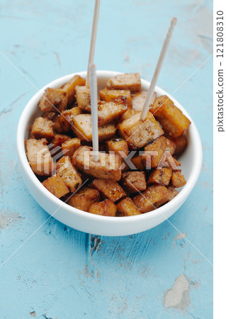 marinated tofu cubes, served as snack 121808310