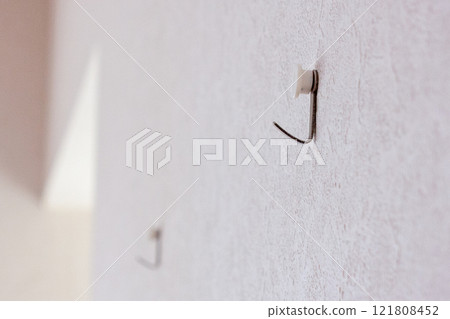 Hooks for hanging pictures on the wall Hooks for hanging pictures on the wall 121808452