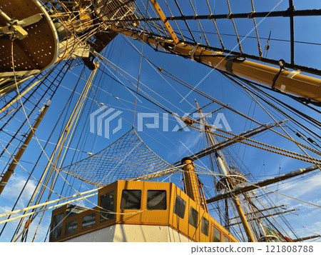 Ropes stretched across the masts of an old ship Ropes stretched across the masts of an old ship 121808788